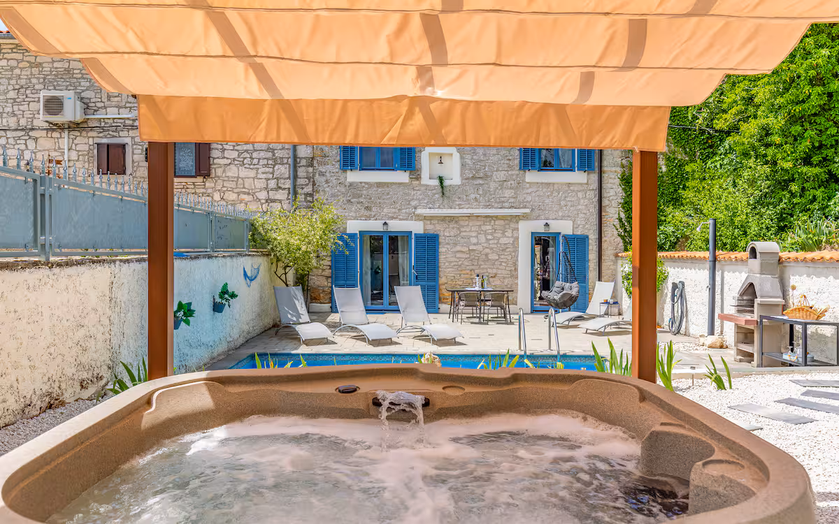 Pool, jacuzzi and stone house